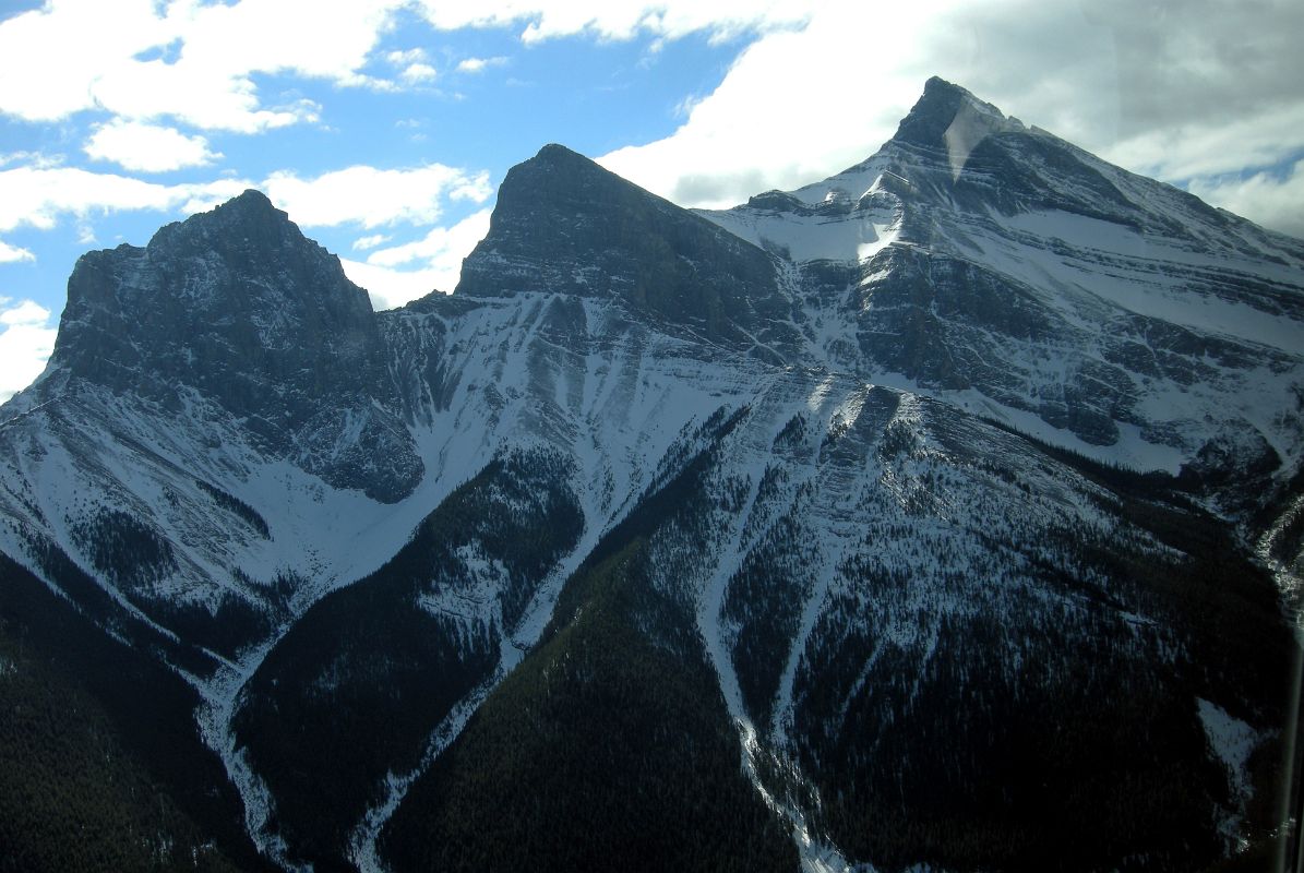 08 The Three Sisters - Charity Peak, Hope Peak and Faith Peak From Helicopter Just After Takeoff From Canmore To Mount Assiniboine In Winter